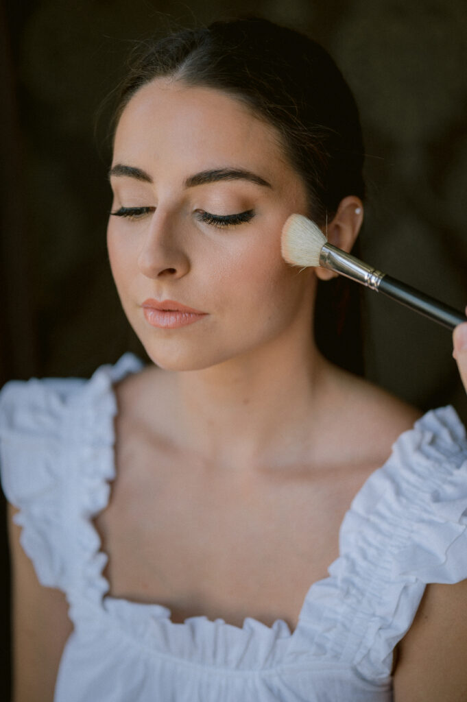 bride getting makeup applied for her bridal trial